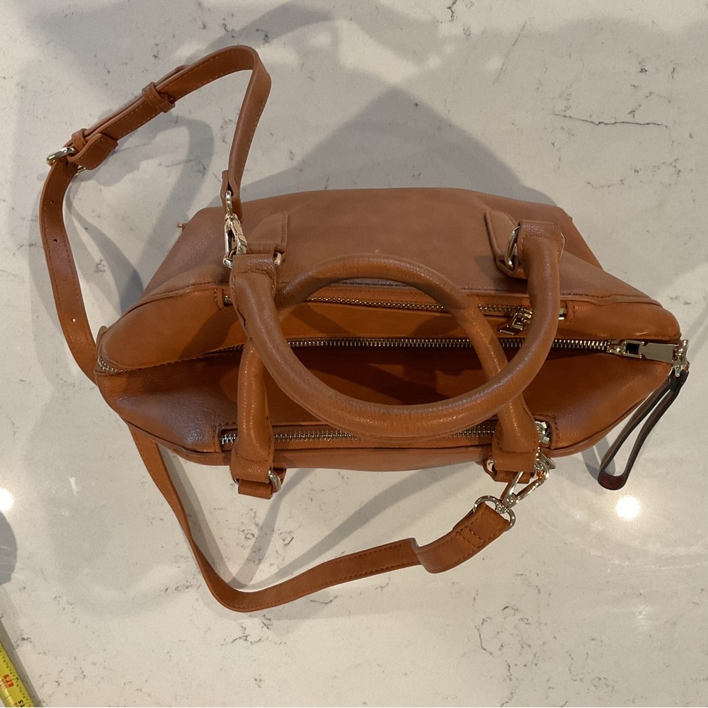 Urban Expressions Tan Crossbody or Hobo purse. Three zippers outside NWOT.